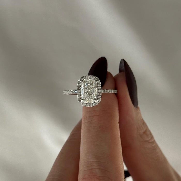 Elongated cushion moissanite halo engagement ring with pave band in white gold, view 2