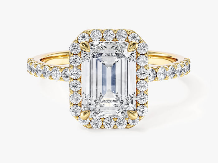 Emerald cut lab grown diamond halo engagement ring with pave band in yellow gold, front view