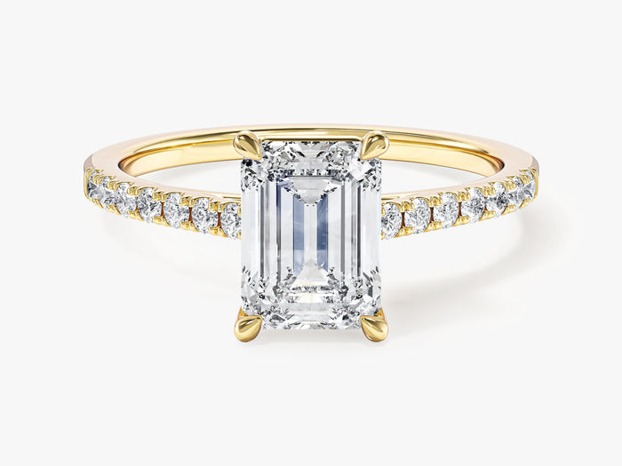 Emerald cut lab grown diamond half pave side stone engagement ring in yellow gold, front view