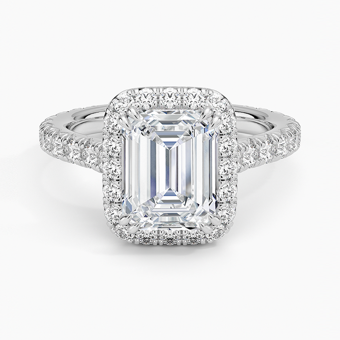Emerald cut moissanite halo ring with three quarter pave band in white gold, top view