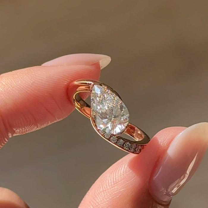East west pear moissanite swirl pave engagement ring in rose gold