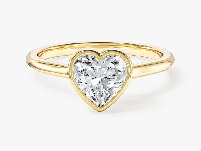 Dainty heart moissanite bezel engagement ring in yellow gold, front view