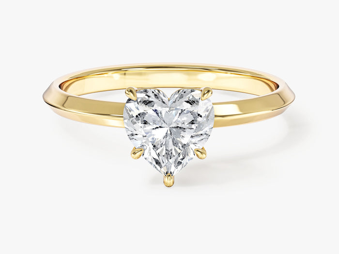 Heart cut lab grown diamond dainty solitaire on a knife edge shank in yellow gold, front view