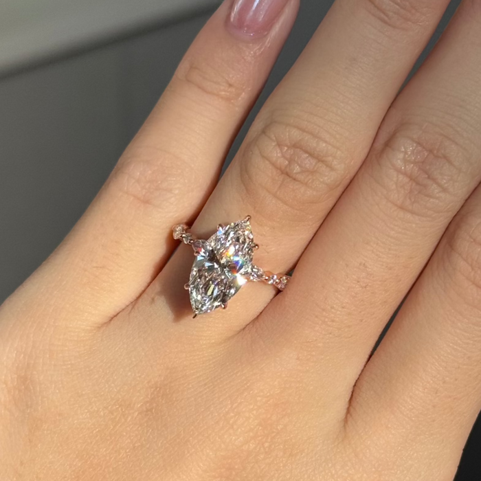 Marquise moissanite engagement ring with marquise and round accent shoulders in rose gold, view 2