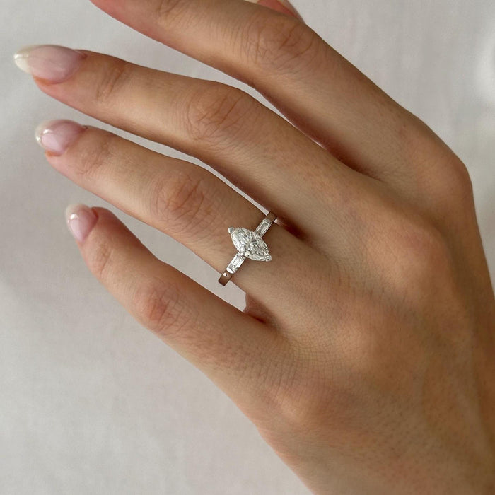 Marquise cut moissanite three stone engagement ring with baguette side stones in white gold