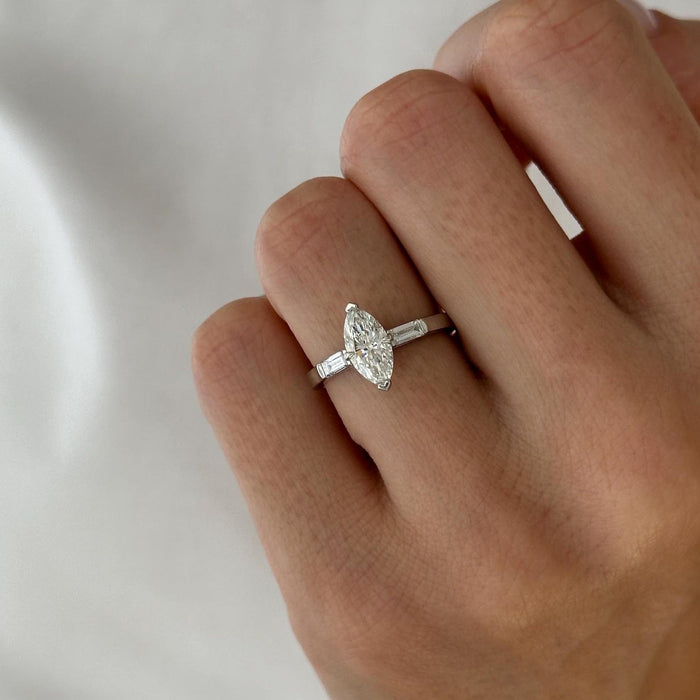Marquise cut moissanite three stone engagement ring with baguette side stones in white gold, view 2