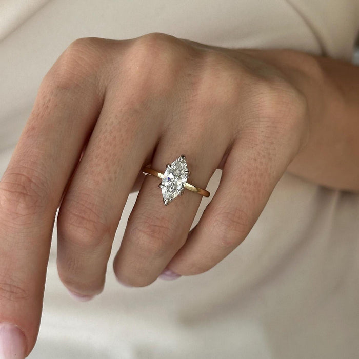 Marquise cut moissanite two tone flat band engagement ring in white and yellow gold, view 2