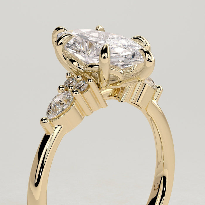 Marquise moissanite engagement ring with pear and round cluster shoulders in yellow gold, view 2