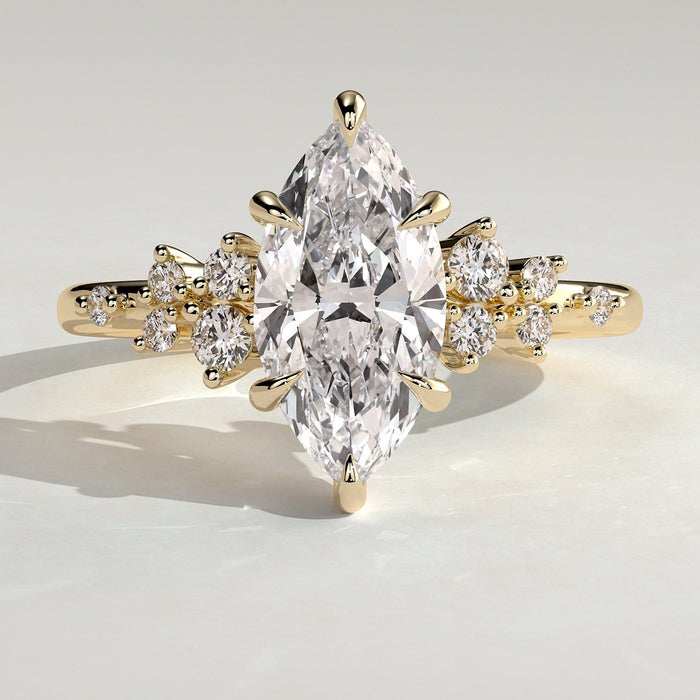 Marquise cut moissanite scattered cluster shoulder engagement ring in yellow gold