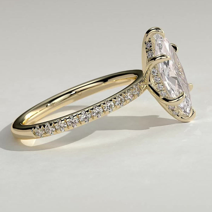 Marquise cut moissanite six claw engagement ring on a pave yellow gold band, view 2