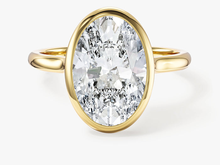 Large oval moissanite bezel solitaire engagement ring in yellow gold, front view