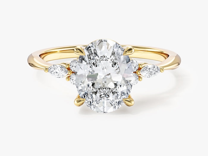 Oval cut moissanite cluster engagement ring with marquise side stones in yellow gold, front view
