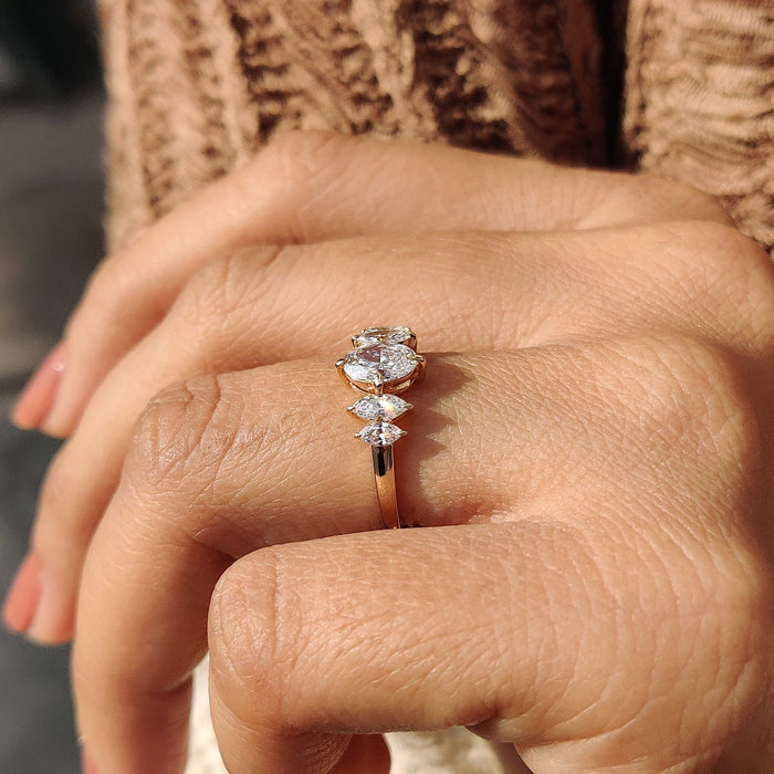 Oval cut moissanite five stone marquise cluster engagement ring in yellow gold, view 2