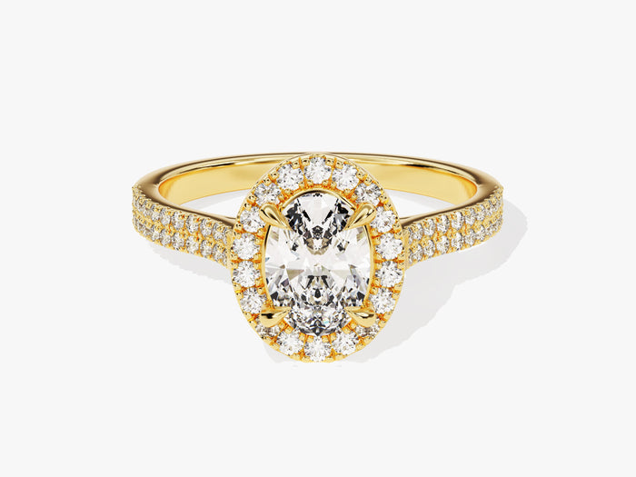 Petite oval halo moissanite engagement ring with double pave shank in yellow gold, front view