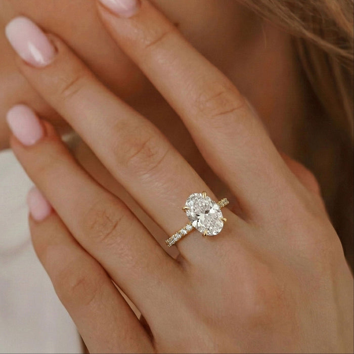 Oval cut moissanite pave band engagement ring in yellow gold, view 2
