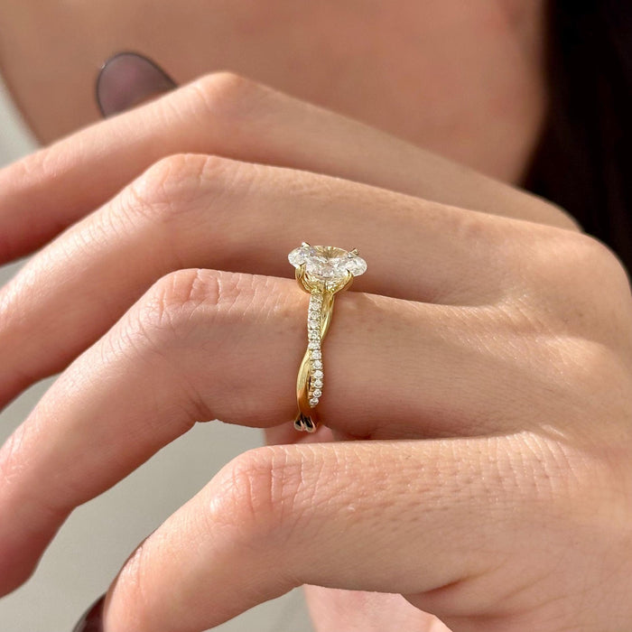 Oval cut moissanite twisted pave engagement ring in yellow gold, view 2
