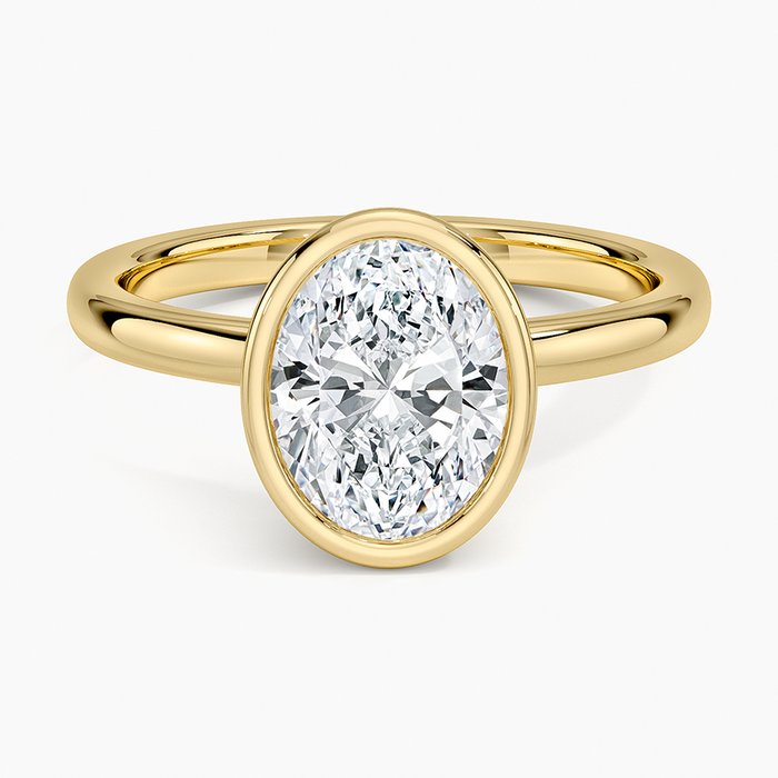 Full bezel oval moissanite on a slim yellow gold band, top view