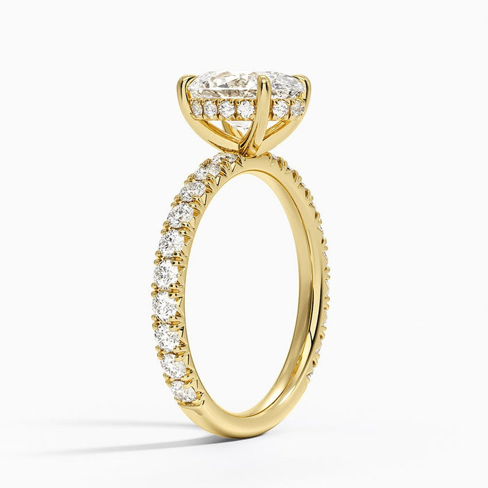 Side view showing the hidden halo under the oval stone and pave running down the shank
