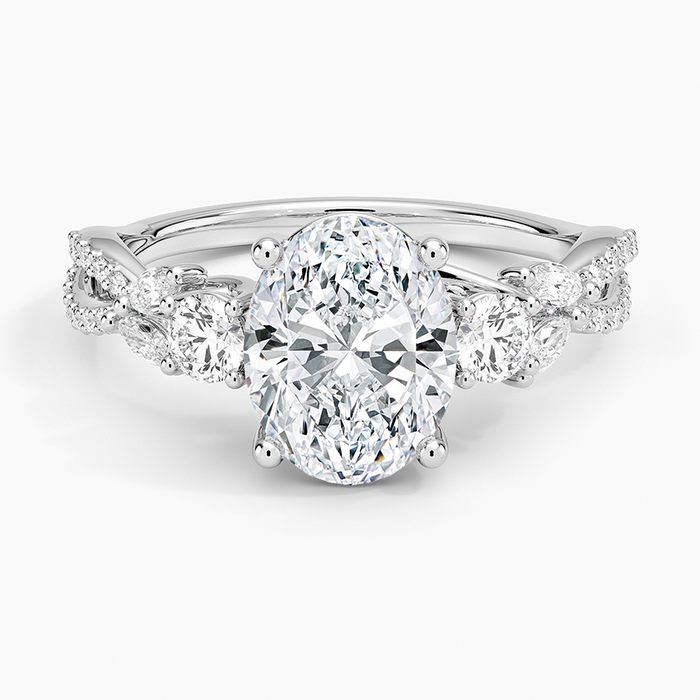 Oval moissanite three stone engagement ring with braided pave vine band in white gold