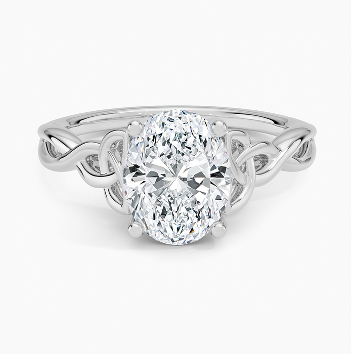 Oval moissanite solitaire on a woven Celtic knot band in white gold, top view