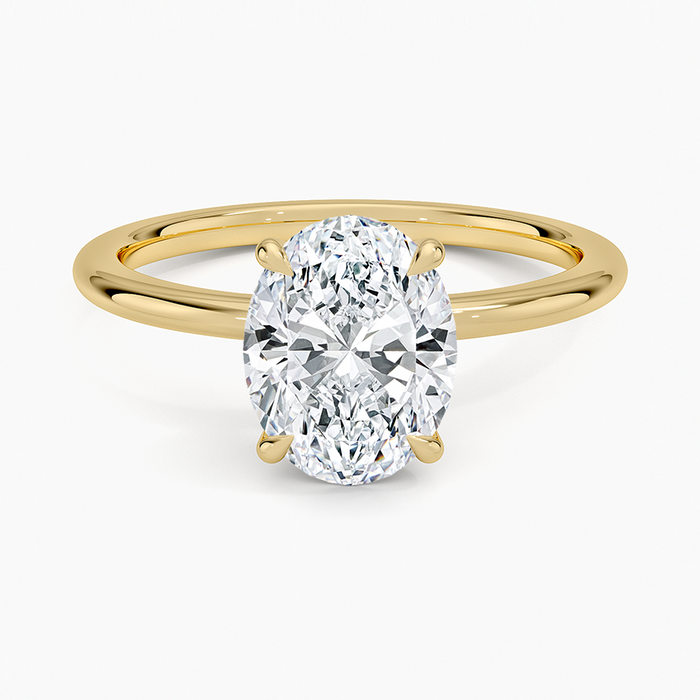 Oval moissanite classic solitaire engagement ring in yellow gold, top view