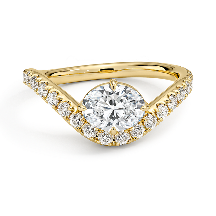 Moissanite set in the point of a chevron pave yellow gold band, top view
