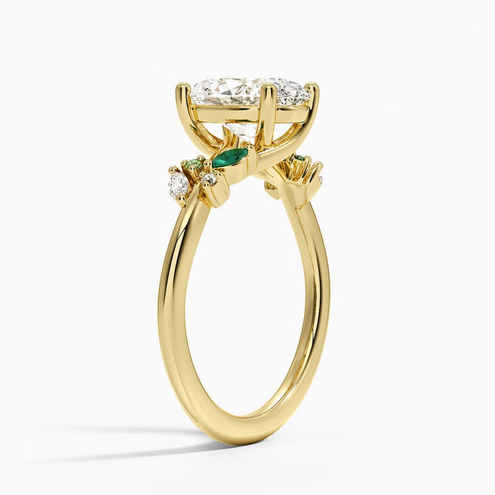 Side profile showing green emerald marquise leaves and colorless accents