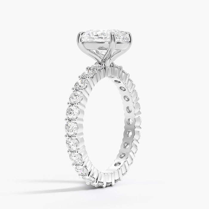 Side view showing round moissanite accents continuing around the full band
