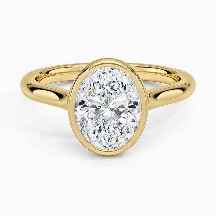 Oval moissanite full bezel solitaire engagement ring in yellow gold, top view