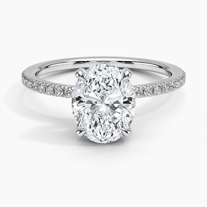 Oval moissanite on a half coverage micropave white gold band, top view