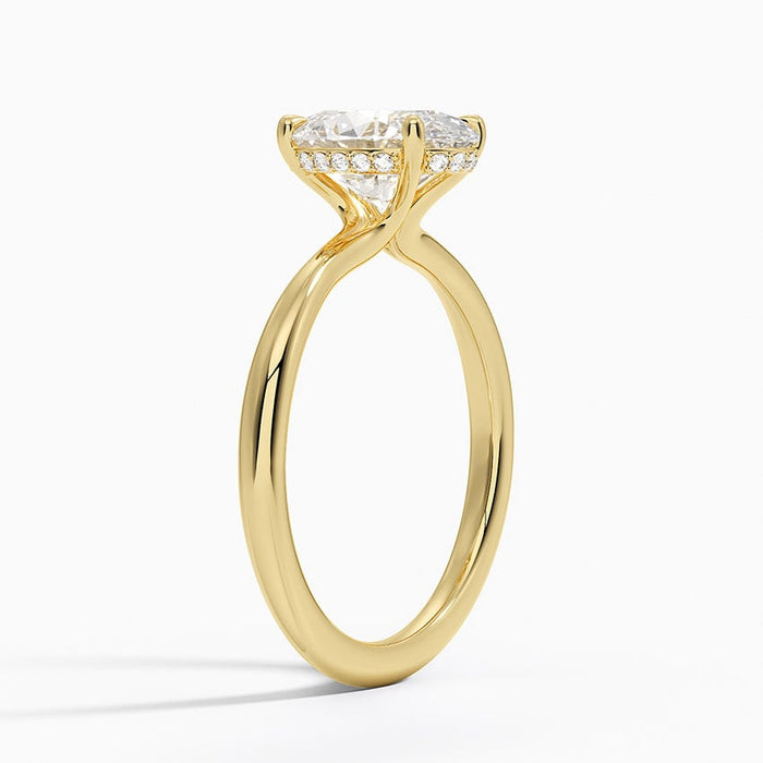 Side profile showing the hidden pave halo under the oval moissanite
