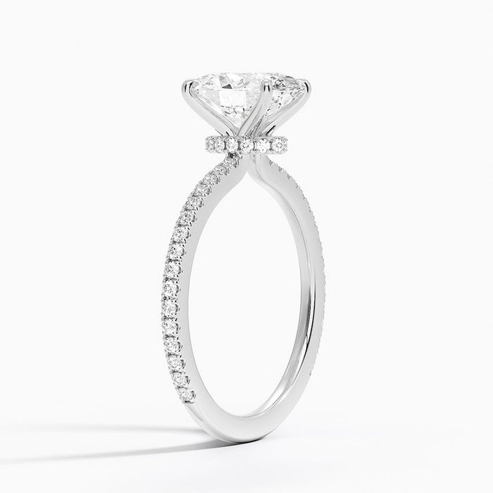 Side profile showing hidden halo collar and scalloped pave band in white gold