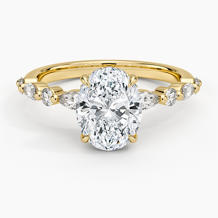 Oval moissanite hidden halo ring with marquise and round shared prong band in yellow gold