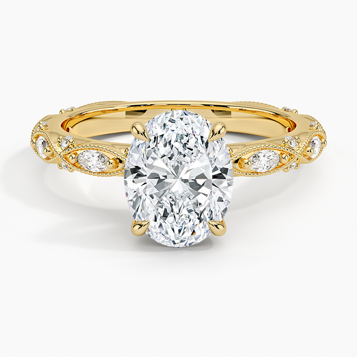 Oval moissanite on a marquise milgrain frame band in yellow gold, top view