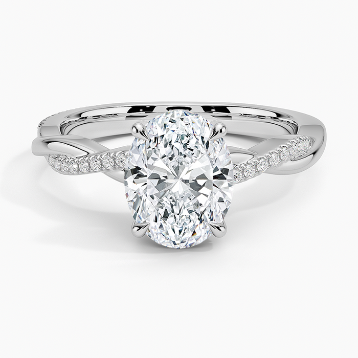 Oval moissanite on a petite twisted vine pave band in white gold, top view