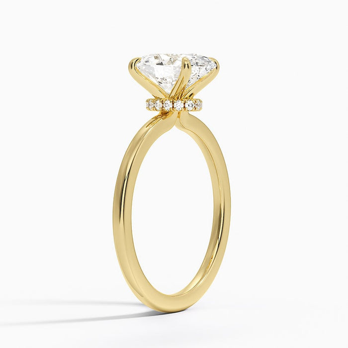 Side profile showing the secret halo pave collar under the oval moissanite