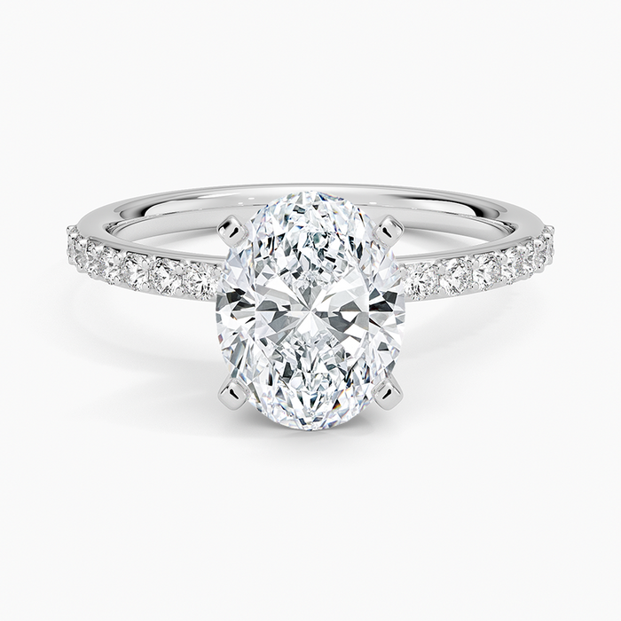 Oval moissanite shared prong pave engagement ring in white gold, top view