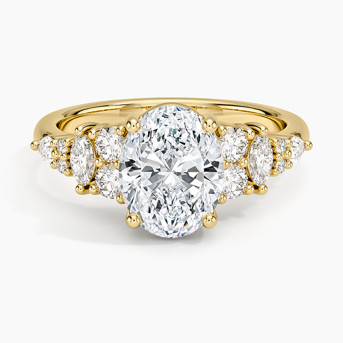 Oval moissanite with alternating round and marquise accents in yellow gold, top view