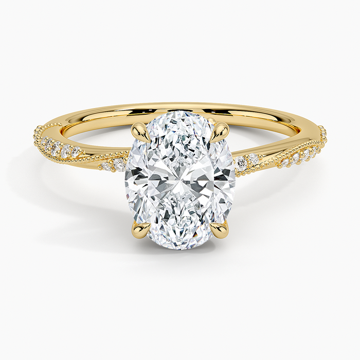 Oval moissanite twisted pave and milgrain engagement ring in yellow gold, top view