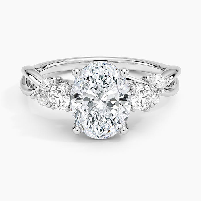 Oval moissanite vine three stone engagement ring in white gold, top view