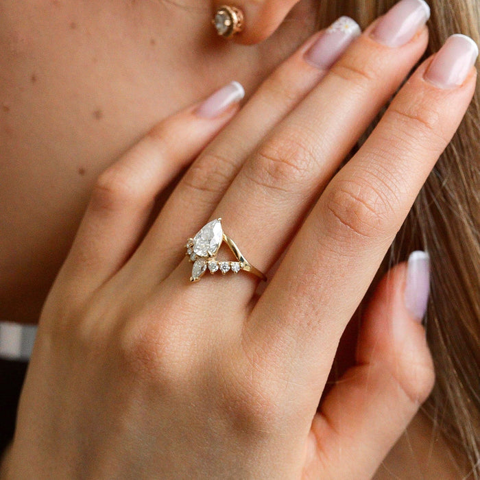 Pear cut moissanite crown cluster engagement ring in yellow gold, view 2