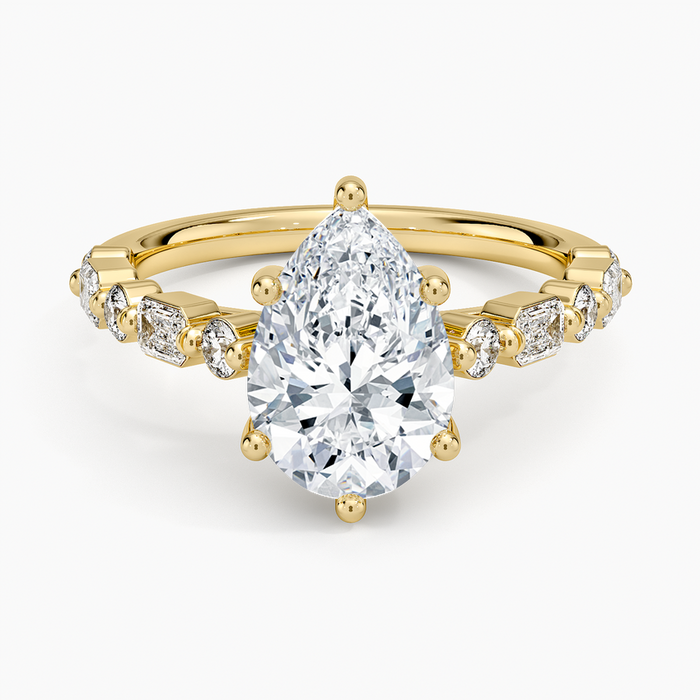 Pear cut moissanite ring with alternating bar set baguettes and ovals, top view