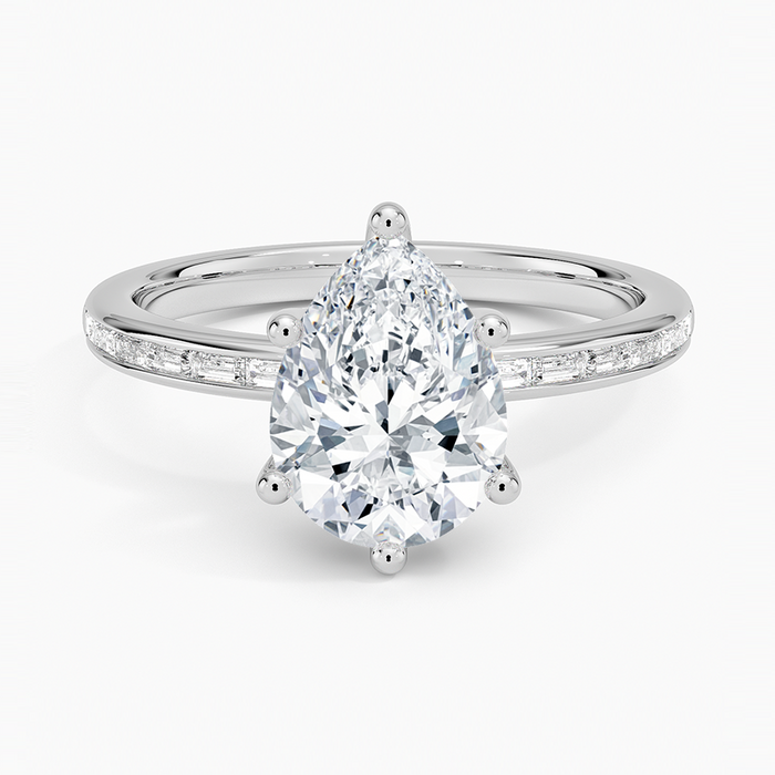 Pear cut moissanite channel set baguette engagement ring in white gold, top view