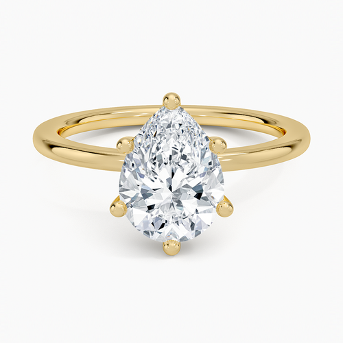Pear cut moissanite in six claws on a plain slim round band in yellow gold, top view