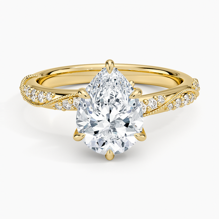 Pear cut moissanite milgrain twisted pave engagement ring in yellow gold, top view