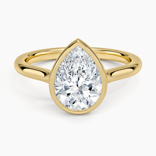 Pear cut moissanite in a fine bezel on a slim band in yellow gold, top view