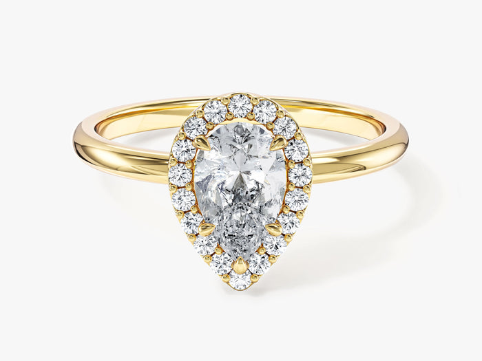 Dainty pear halo moissanite engagement ring with thin plain shank in yellow gold, front view