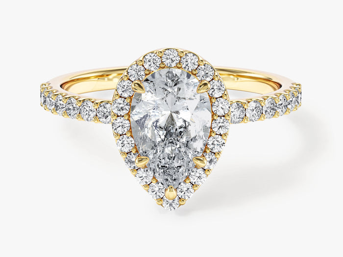 Pear shaped moissanite classic halo engagement ring with half pave band in 14K yellow gold, front view