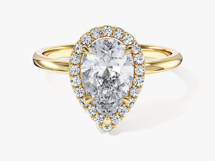 Pear shaped moissanite halo engagement ring with slim plain band in yellow gold, front view