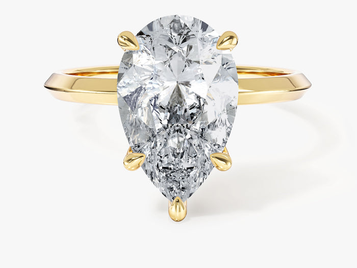 Large pear lab grown diamond statement ring with knife edge shank in yellow gold, front view